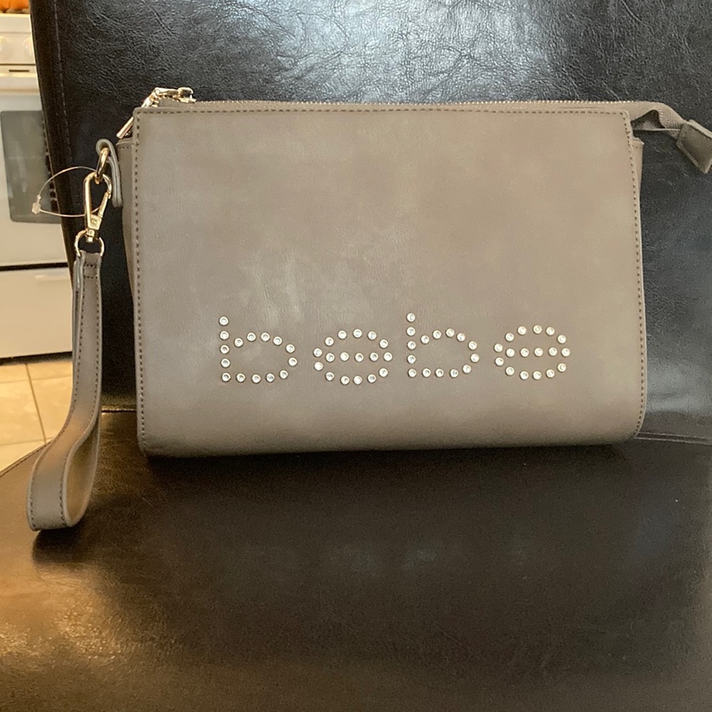 Bebe clutch/wristlet brown and gold zipper and gold bebe writing